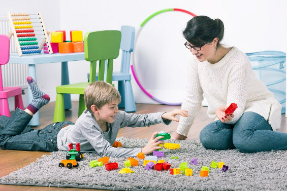 Therapist and child playing